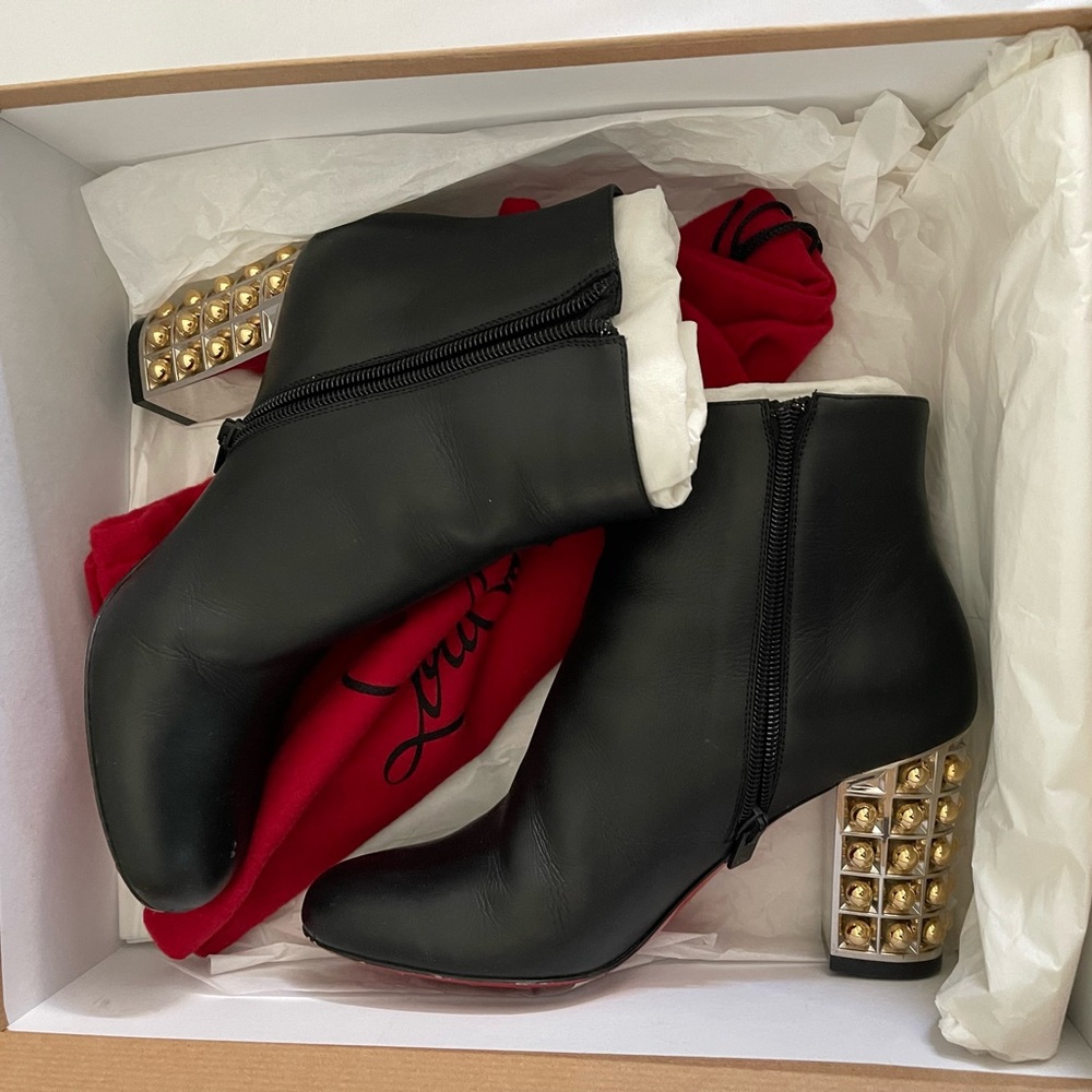 Christian Louboutin Vasa Booty with chrome and gold heels.